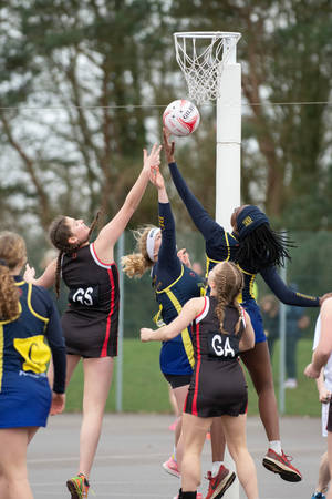 Netball Game Girls High Jump Ball Wallpaper