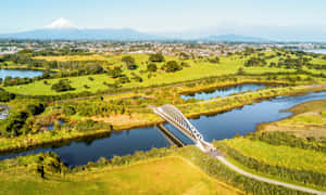 New Plymouth Aerial Viewwith Mount Taranaki Wallpaper