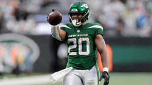 New York Jets Player Breece Hall In Action Wallpaper