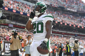 New York Jets Player Celebratingon Field Wallpaper