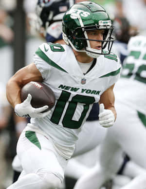 New York Jets Player Running With Football Wallpaper