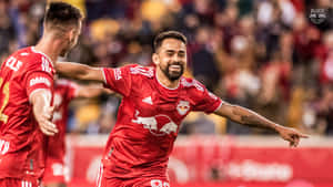 New York Red Bulls Midfielder Luquinhas Celebrating His Fifth Goal Wallpaper