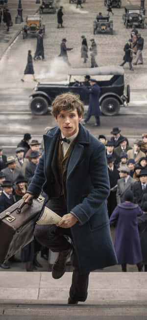 Newt Scamander And His Fantastic Beasts In An Adventure Wallpaper