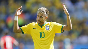 Neymar Jr Showing Off His Signature Brazilian No. 10 Uniform Wallpaper