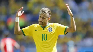 Neymar Jr Showing Off His Signature Brazilian No. 10 Uniform Wallpaper