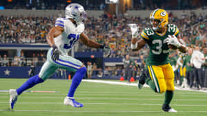 Nfl Running Back, Aaron Jones, In Action Wallpaper