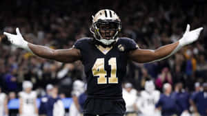 Nfl Running Back Alvin Kamara Takes Off With The Ball Wallpaper