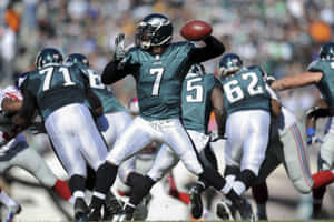 Nfl Superstar Michael Vick In Action Wallpaper