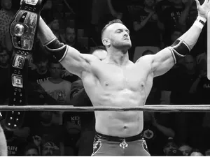 Nick Aldis Victory Posewith Championship Belt Wallpaper