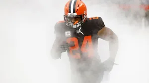 Nick Chubb Emerging From Mist Wallpaper