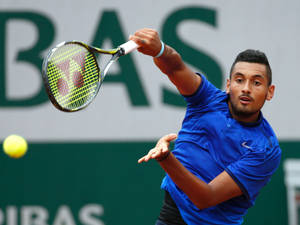 Nick Kyrgios Striking Tennis Ball Wallpaper