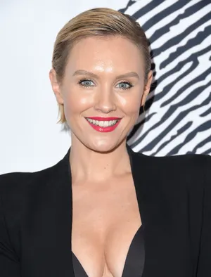 Nicky Whelan Striking A Pose In A Stylish Outfit Wallpaper