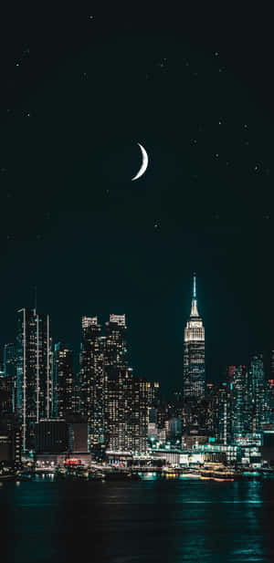 Night Cityscape With Crescent Moon Wallpaper