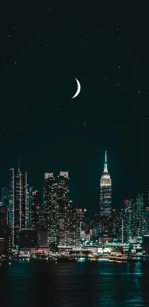 Night Cityscape With Crescent Moon Wallpaper