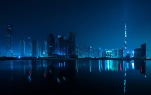 Nighttime Cityscape Reflections Wallpaper