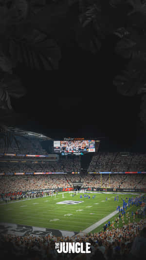 Nighttime Football Game Stadium View Wallpaper