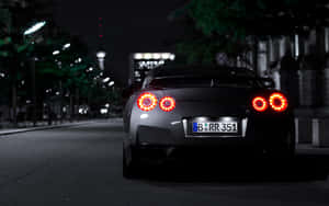 Nighttime_ Sports_ Car_ Back_ View Wallpaper