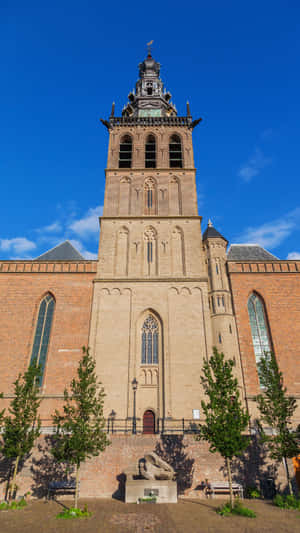 Nijmegen Church Towerand Statue Wallpaper