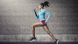 Nike Girl Athlete Running Wallpaper