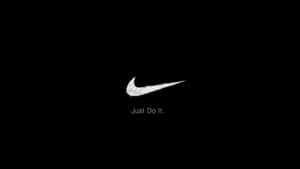 Nike Logo On A Black Background Wallpaper