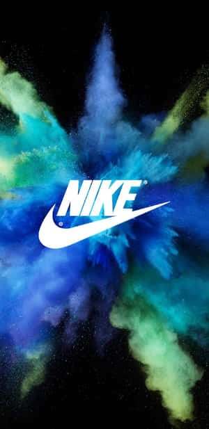 Nike Logo On A Black Background With Colorful Powder Wallpaper