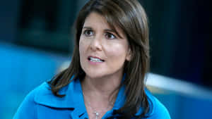 Nikki Haley In A Vibrant Blue Polo Shirt Wallpaper