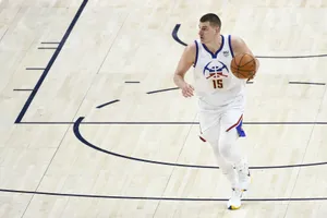 Nikola Jokic In Mid-action Wallpaper