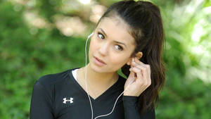 Nina Dobrev With Earphones Wallpaper