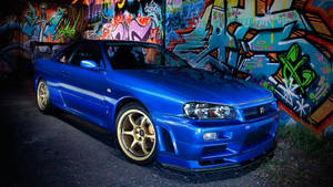 Nissan Skyline Gtr R34 Near Grafitti Wallpaper