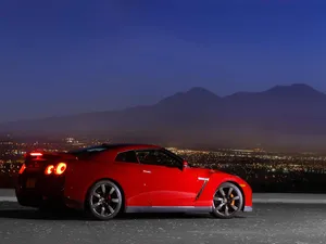 Nissan Skyline Gtr R35 City And Mountain View Wallpaper