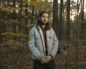 Noah Kahan Forest Portrait Wallpaper