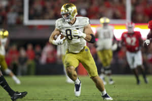 Notre Dame Football Player Running Action Wallpaper