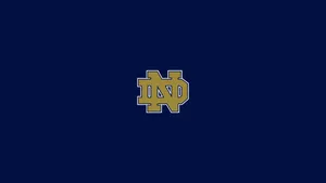 Notre Dame Logo On A Blue Background Wallpaper
