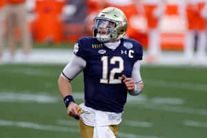 Notre Dame Quarterback Ian Book Action Wallpaper