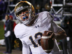 Notre Dame Quarterback Ian Book Action Shot Wallpaper