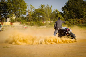 Ns 200 Pulsar Man Riding With Dust Wallpaper