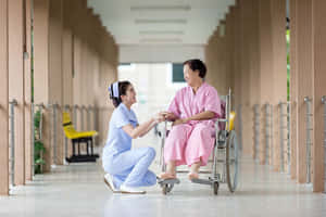 Nursing With Old Woman Patient Wallpaper