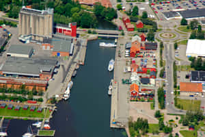 Nykoping Aerial Viewof Riverand Marina Wallpaper