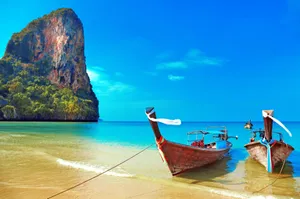 Oceanic Solitude: Alone Boat At Sunrise Wallpaper