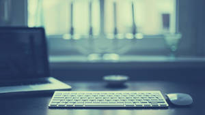 Office Desk Next To A Window Wallpaper