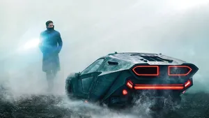 Officer K (ryan Gosling) In A Chase Scene From Blade Runner 2049 Wallpaper