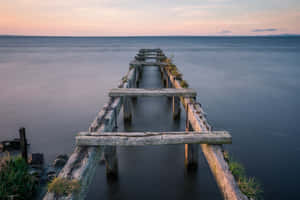 Old Wooden Pierat Sunset Wallpaper