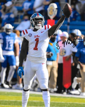 Ole Miss_ Football_ Player_ Celebration Wallpaper