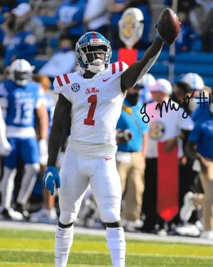 Ole Miss_ Football_ Player_ Celebration Wallpaper