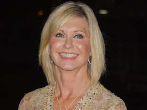 Olivia Newton John In Beige Dress Wallpaper