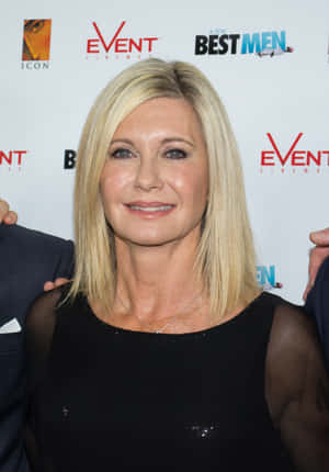 Olivia Newton John In Black Sheer Top Wallpaper