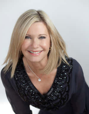 Olivia Newton John In Black Top Wallpaper