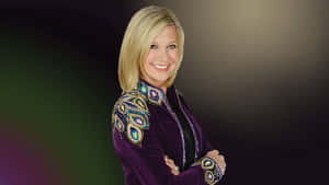 Olivia Newton John In Peacock-inspired Jacket Wallpaper