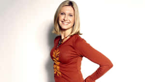 Olivia Newton John In Red-orange Long Sleeve Wallpaper