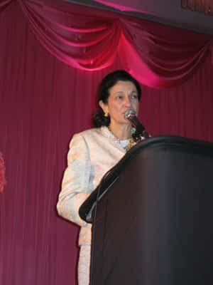 Olympia Snowe Elegantly Dressed In Cream Wallpaper